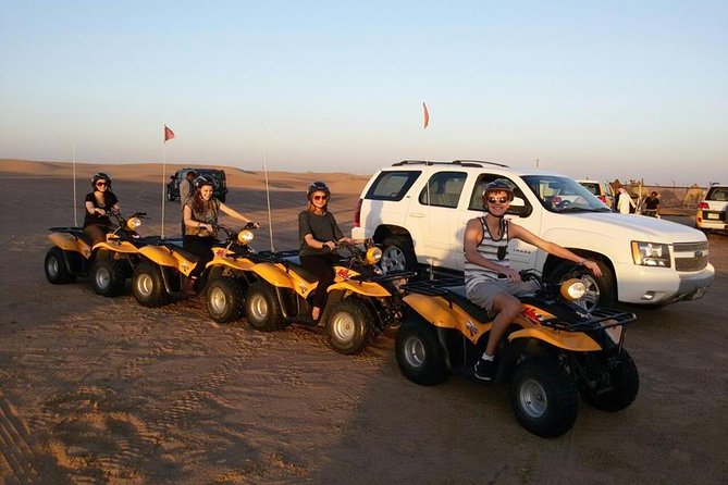 Dubai Desert Morning Tour in 4WD Vehicle: Camel Ride, Quad Bike Tour, Sandboarding, and Camel Farm - Sandboarding on desert dunes: the downhill grin factor