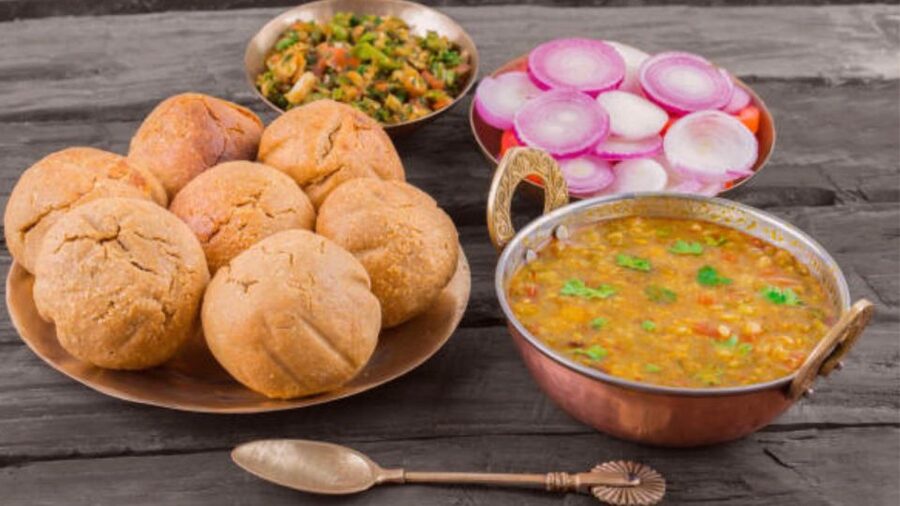 Farm to Table: With a local farmer family - The meal: Dal Bati Churma, saag, chaas, and a group feast under a neem tree