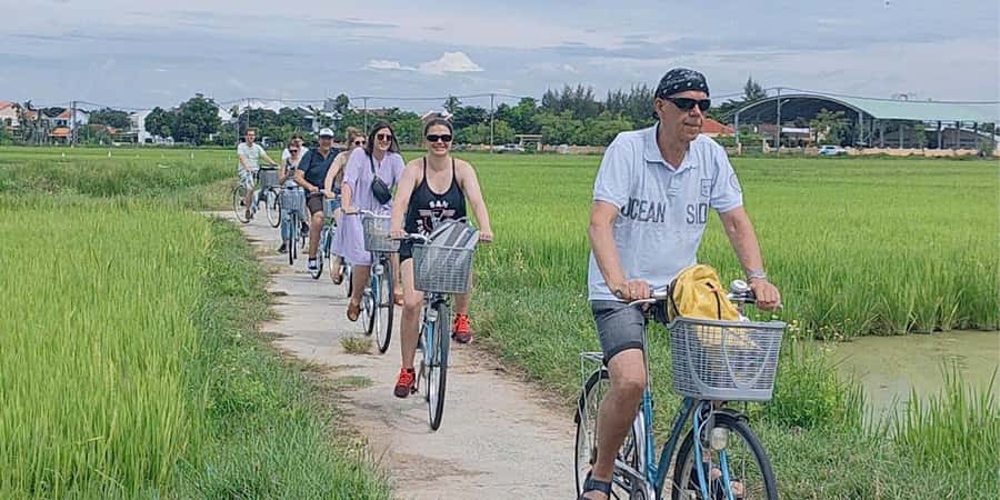 Hoi An: Countryside Bicycle Tour with Farm, Basket Boat Ride - Rice fields, fish and shrimp farms, and the hands-on farming moment
