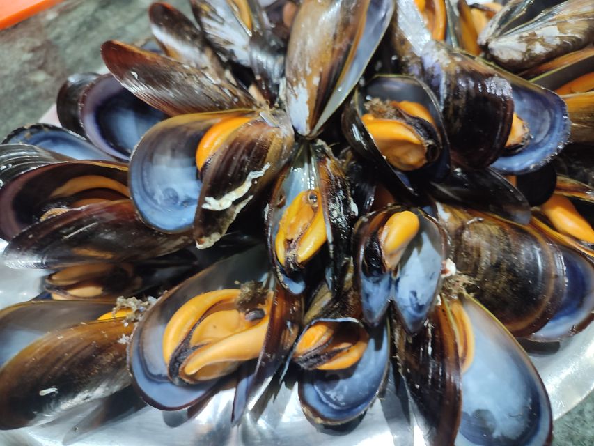 Ría de Arousa: Boat Ride to Mussel Farm with Tasting - From Port of O Grove to the bateas: the 75-minute flow