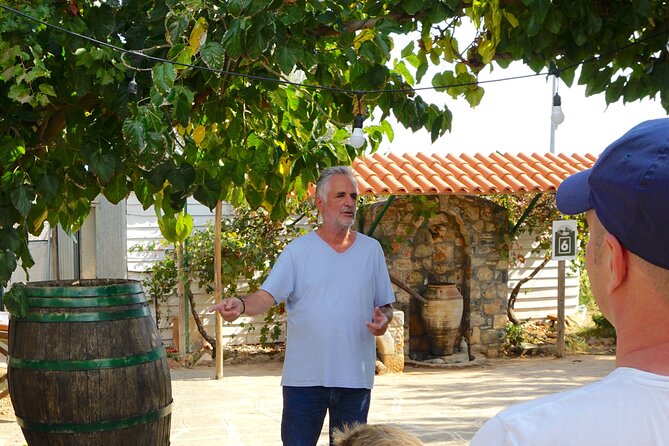 Traditional Olive Oil Making at Spiridi Olive Oil Farm - Crete - Crushing with a stone mill: pushing the weight matters